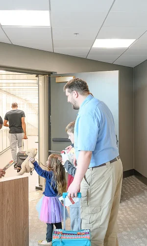 A family boarding a plane at Texarkana Regional Airport